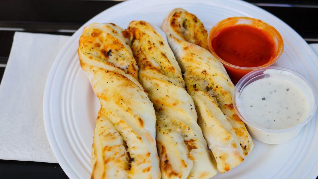 Garlic Parmesan Twists (3) · Garlic Parmesan twists are rolled fresh daily and baked to perfection with fresh garlic and Parmesan cheese. 170 cal. per twist.