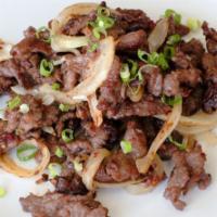 Mongolian Beef · Aromatic tender beef seared with onions, red chili flakes.