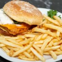 Fish Sandwich · Deep fried fish filet on grilled bun dressed with cheese and tartar sauce . served with frie...
