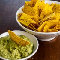 Chips & Guacamole · Fresh avocado, diced onion, tomato and cilantro (four ounces), and fried corn tortilla chips.