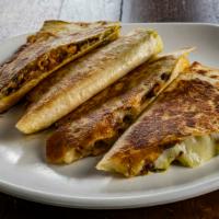 Chando'S Quesadilla · Select your favorite of chando's signature meat and enjoy it sandwiched between a giant flou...
