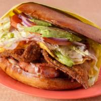 Torta Cubana · Includes breaded steak, egg, chorizo, sausage, ham prepared with mayo, beans, lettuce, tomat...