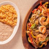 Fajitas Mixtas · Chicken, beef and shrimp fajitas bell peppers and onion. Served with rice and beans.