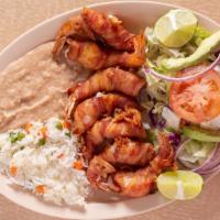 Camarones Costa Azul · Shrimp wrapped in bacon with mozzarella cheese inside. Served with white rice, beans, and sa...
