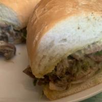 Philly Cheese Steak Sandwich · Freshly grilled skirt steak served with grilled onions, red bell peppers, American cheese, m...
