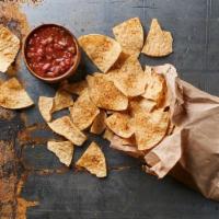 Chips & Salsa · Crispy seasoned tortilla chips served with smoky salsa roja