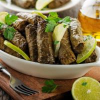 Grape Leaves · Hand-rolled grape leaves stuffed with rice, tomatoes, onions, and parsley