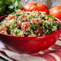 Tabbouleh  · Bulgur wheat, tomatoes, parsley, onion, served with lemon and olive oil dressing.