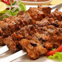 Steak Kebab · Charbroiled beef steak chunks, marinated in olive oil and spices.
