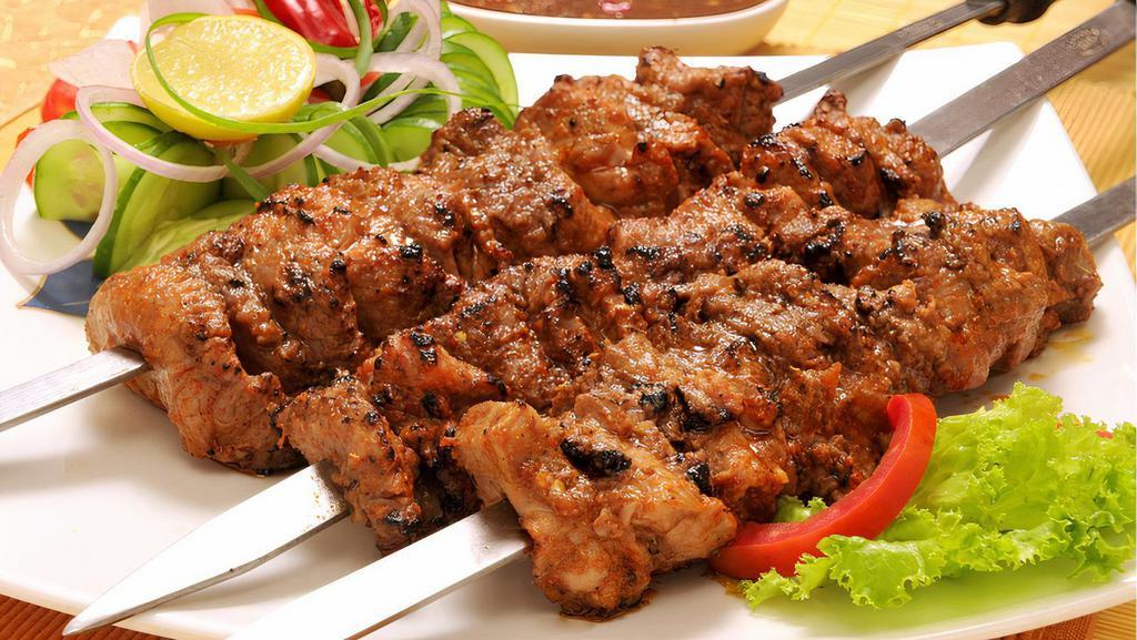 Steak Kebab · Charbroiled beef steak chunks, marinated in olive oil and spices.