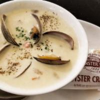 E. Clam Chowder · New England style, manila clams, lardon, clam broth.