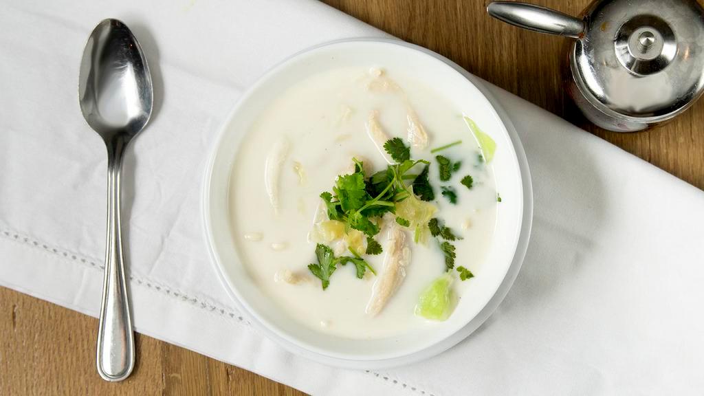 Tom Kha Soup · Creamy and rich coconut soup with lemongrass, lime juice, galangal, mushrooms, and cilantro.