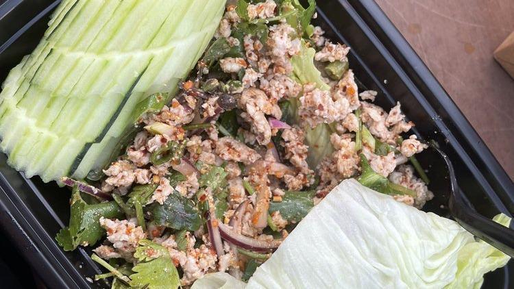 Larb · Spicy chopped chicken or tofu salad with lime juices, mints, cilantro, red onions, Thai chilies, and toasted rice powder.