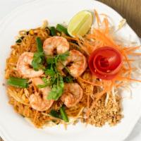 Pad Thai Noodles · Thin rice noodles cooked in a wok with egg, green onions, bean sprouts, peanuts in tamarind ...