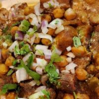 Aloo Tikki Chaat · Chopped aloo Tikki smothered with garbanzo beans and topped with yogurt, mint and tamarind c...
