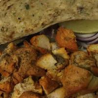 Chicken Tikka Plate · Boneless tandoori chicken pieces served over basmati rice with garlic naan, daal, and cucumb...