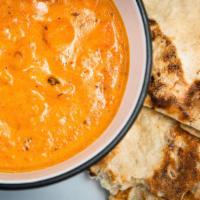Chicken Tikka Masala · Dish made using house roasted spices, tomatoes, onion, cream, and a dash of fenugreek with b...