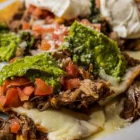 Super Nachos With Choice Of Meat · Corn tortilla chips, loaded with Jack cheese, beans, enchilada sauce, salsa fresca, guacamol...