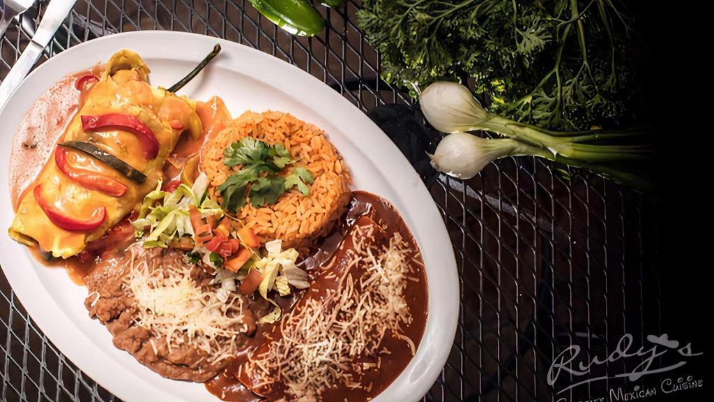 El Grande Platter · Choose 2 Items: Chili Relleno, Tamale, Enchilada or Grande Taco. Served with Rice and choice of Beans.