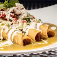 Chicken Flautas · Topped with tomatillo sauce, queso fresco, sour cream and salsa fresca, served with rice and...
