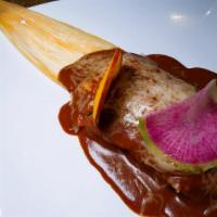 2 Homemade Tamales · Your choice of pork, chicken or sweet potato, topped with enchilada sauce and Jack cheese.