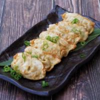 Potstickers · 7pc deep fried chicken & pork mixed dumplings served with ponzu sauce.