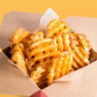 Seasoned Waffle Fries · Skin - on potato waffle fries with signature cajun seasoning.