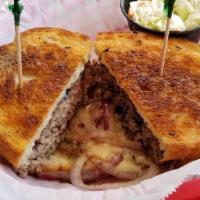 Patty Melt Sandwich · Ground beef patty with melted American cheese and onions on grilled rye bread.