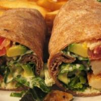 Wrap · Grilled chicken breast, blackened salmon or grilled shrimp with romaine lettuce, tomatoes, a...