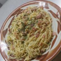 Spaghetti Carbonara · Ham sautéed with garlic, onions, and spices, tossed with spaghetti, egg and cheese.