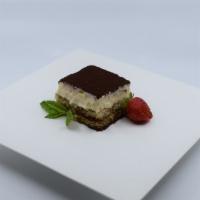 Tiramisu · The classic Italian dessert. A layer of creamy custard set atop espresso-soaked ladyfingers.