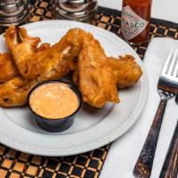 Fried Pickles · Kosher dill pickle spears smothered in freshly made beer batter and served with house-made s...