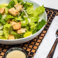 Caesar Salad · Romaine, Parmesan cheese, and house-made croutons with caesar dressing.