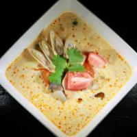 Tom Kha Chicken · Coconut soup with spices, lemongrass, lime juice, mushroom and chicken.