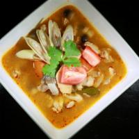 Tom Yum Chicken · Thai spicy and sour soup with lemongrass, lime juice, mushroom and chicken.