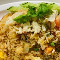 Crab Fried Rice · Snow crab meat pan-fried with Thai jasmine rice, onions, scallions and diced tomatoes. Toppe...