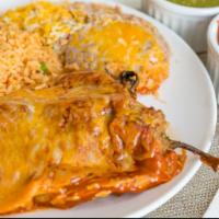 Two Chiles Rellenos · 2 Chile Rellenos topped with enchilada sauce, cheese, lettuce, and sour cream. Served with r...