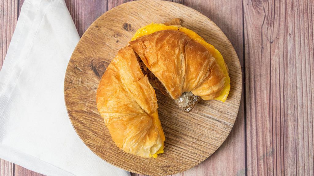 Breakfast Croissant · Fresh buttery flaky croissant to wake up your pallet. Egg and cheese with your choice of ham, bacon or sausage on a croissant.