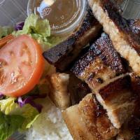 Grilled Liempo · Bone in pork belly with a side of soy sauce vinegar.