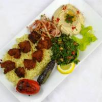 Beef Kebab Plate · Beef fillet skewered and charbroiled to perfection, served with rice, hummus, tabbouleh, tom...