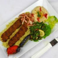 Lule Kebab Plate · Ground beef skewered and charbroiled to perfection, served with rice, hummus, tabbouleh, tom...