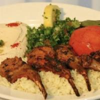 Rack Of Lamb Plate · Rack of Australian lamb charbroiled to perfection, served with rice, hummus, tabbouleh, toma...
