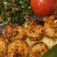 Shrimp Kebab Plate · Whole shrimp skewered and charbroiled to perfection, served with rice, hummus, tabbouleh, to...