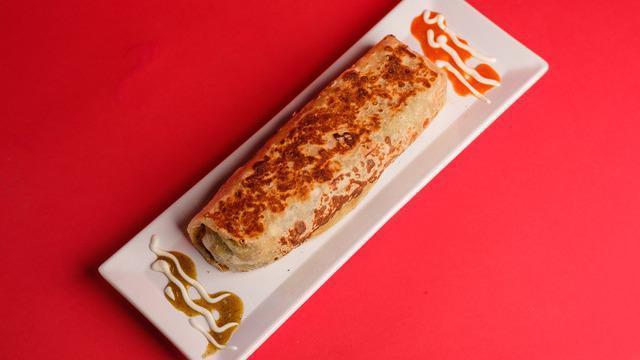 #10. Rts Burrito · Carne Asada, Fries, Sour Cream, Cheese, and Guacamole.
