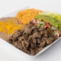 #12. Carne Asada Plate · Your choice of tortilla. Served with lettuce, pico de gallo, guacamole,  rice and beans with...