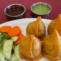 Lamb Samosa · Deep-fried pastries filled with minced lamb and spices