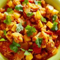 Aloo Gobi · Potatoes and cauliflowers cooked with ginger and tomatoes.