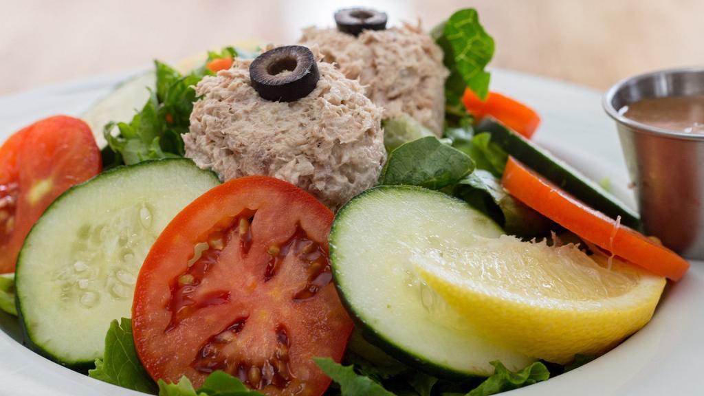 Tuna Salad Salad (Large) · Our Famous Tuna Salad Mix, Tomatoes, Cucumbers, and Lemon Wedges on Green Leaf Lettuce. Balsamic Vinaigrette
