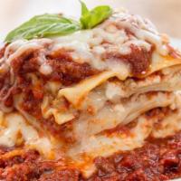 Homemade Meat Lasagna · Four Layers of Beef, Sausage, Mozzarella, and Ricotta