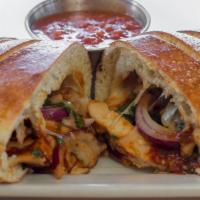 Bbq Chicken Calzone · Chicken, Red Onions, Cilantro, Bullseye BBQ Sauce, Ricotta, Mozzarella. Served with our home...